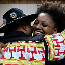 Tracy K. Smith and August Creppel, Principal Chief of the United Houma Nation, embrace at the United Houma Nation Vocational Rehabilitation Office in Houma, LA. December 14, 2018. Credit: Kevin Rabalais.